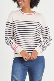 Model Aiyana wearing size 10 of the Portia Stripe Knit in colour Oatnavy (White), from the front, cropped image