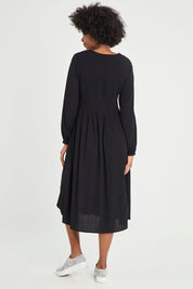 Model Aiyana wearing size 10 of the Lottie Midi Dress in colour Black (Black), from the back