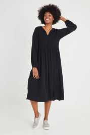 Model Aiyana wearing size 10 of the Lottie Midi Dress in colour Black (Black), from the front, showing the whole outfit