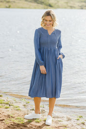Model Alice wearing size 10 of the Jules Dress in colour Blue (Blue), from the front, showing the whole outfit