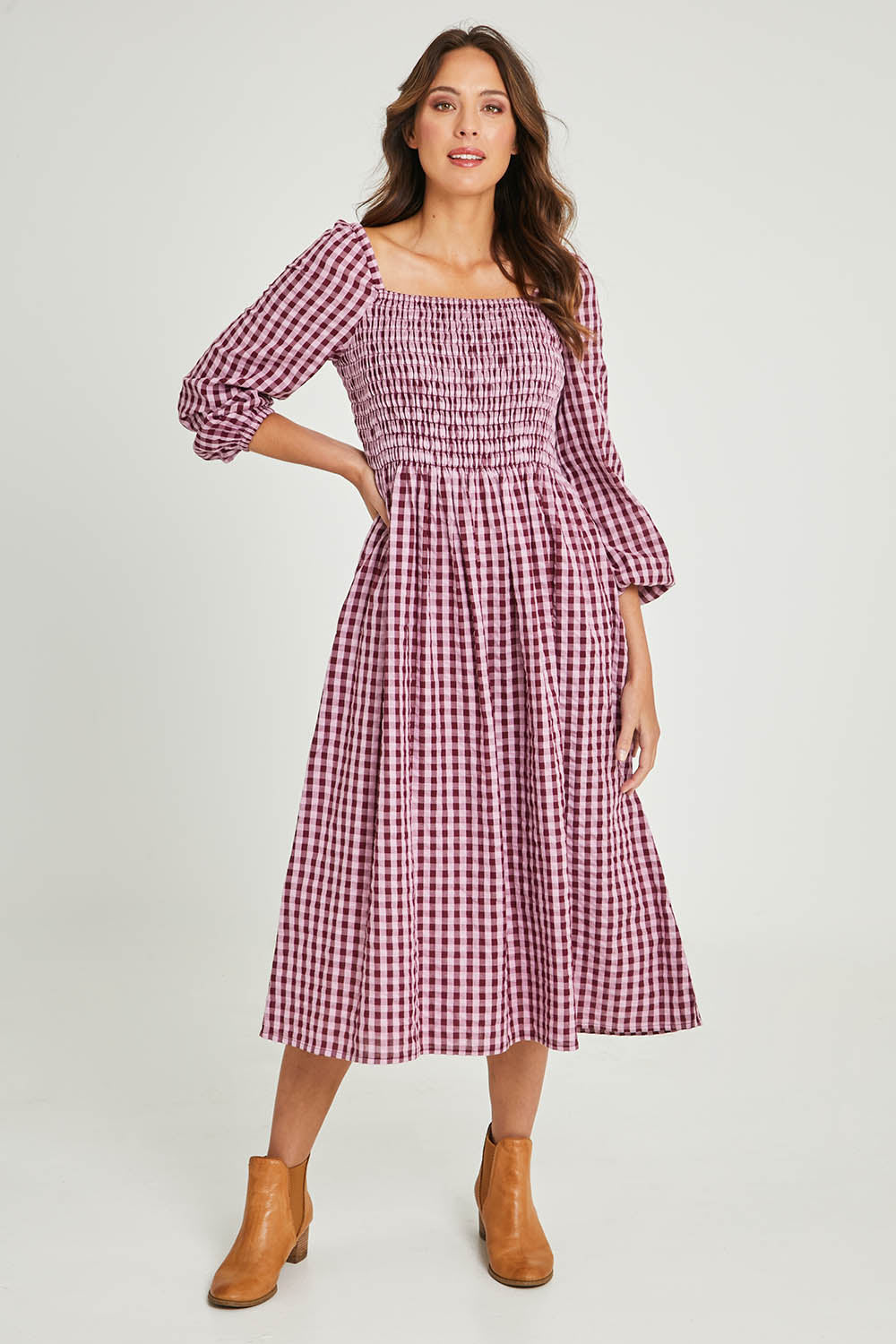 Model Madeline wearing size 10 of the Pippa Check Dress in colour Winecheck (Purple), from the front, showing the whole outfit