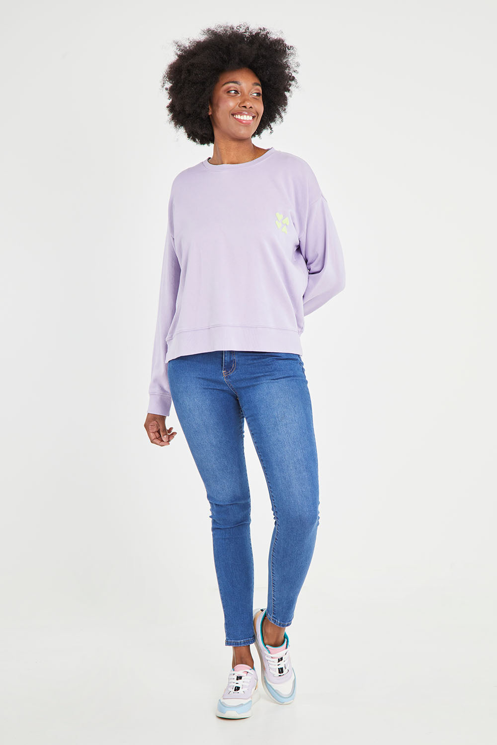 Model Aiyana wearing size 10 of the Young At Heart Crew in colour Purple (Purple), from the front, showing the whole outfit