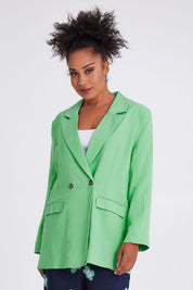 Model Olivia wearing size 10 of the Rhiannon Blazer in colour Meadow (Green), from the front, cropped image