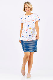 Model Emma wearing size 10 of the Go My Way Skirt in colour Chambray (Blue), from the front, showing the whole outfit