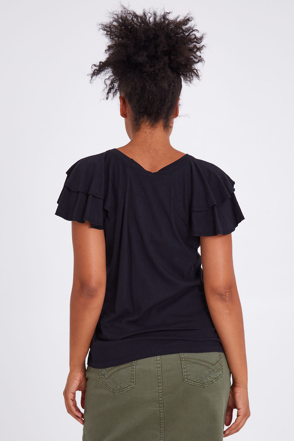 Model Olivia wearing size 10 of the Tulip Tee in colour Black (Black), from the back