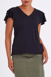 Model Olivia wearing size 10 of the Tulip Tee in colour Black (Black), from the front, cropped image