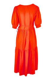 Product shot of the Rosa Dress in colour Tangello (Red), from the back