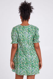 Model Olivia wearing size 10 of the Prairie Floral Dress in colour Prairie (Green), from the back