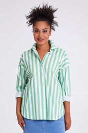 Model Olivia wearing size 10 of the Delia Shirt in colour Meadowwhit (Green), from the front, cropped image