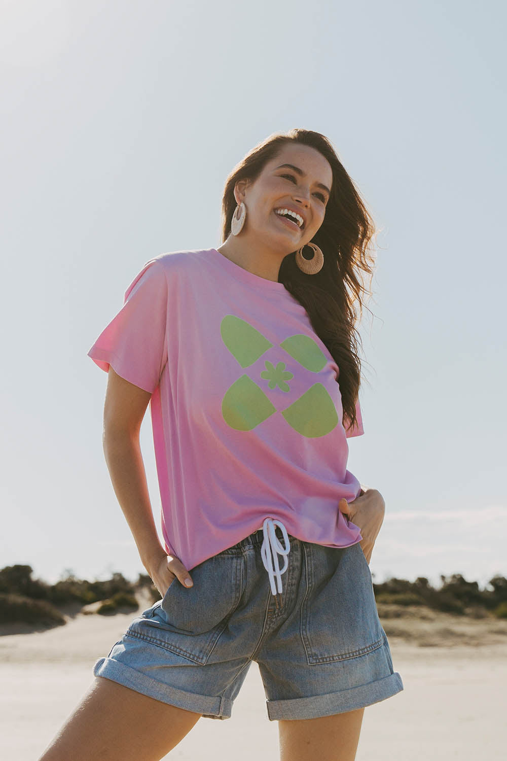 A model wearing the Crossed Tee in colour Sweetlilac (Purple), from the front, showing the whole outfit