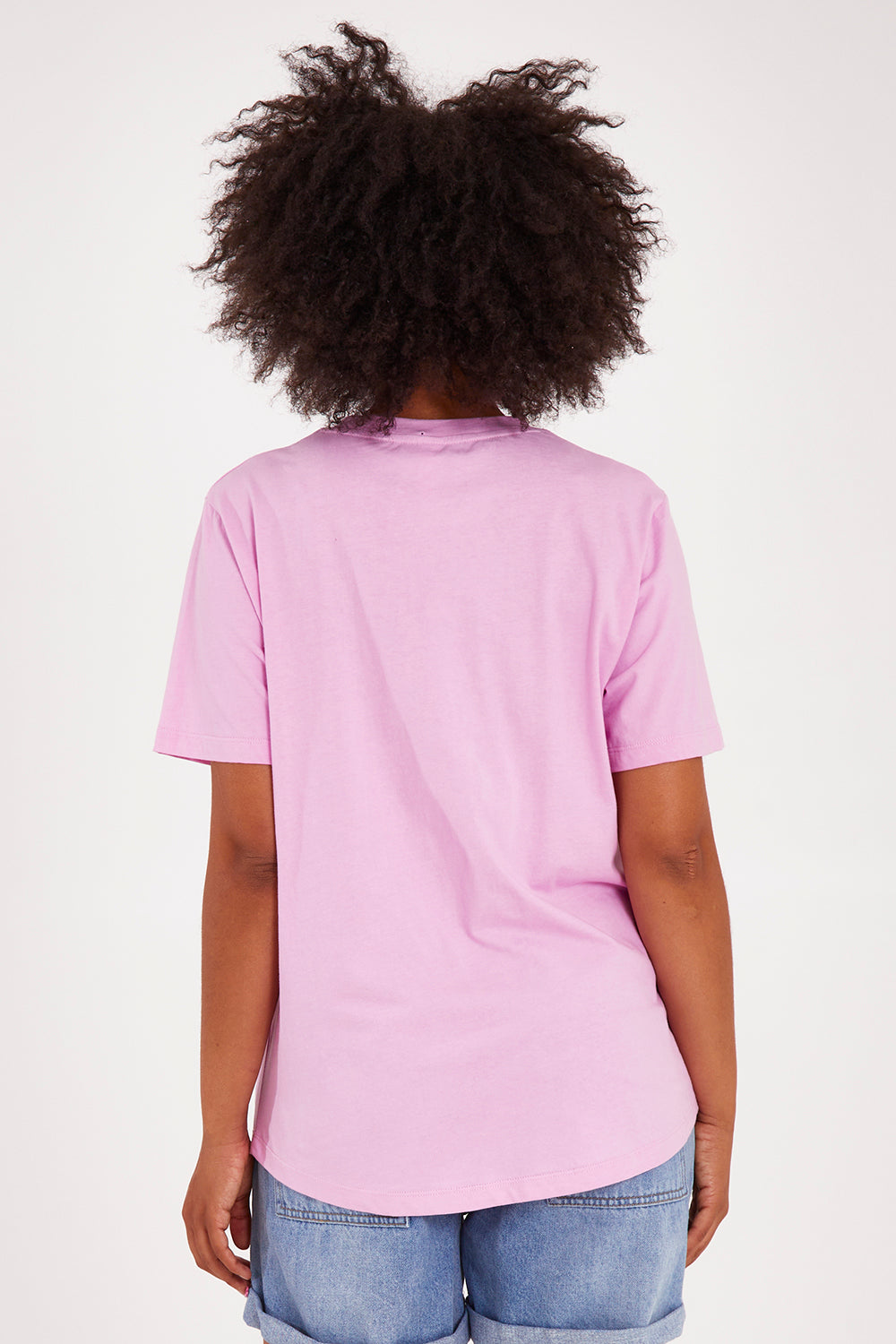 Model Olivia wearing size 10 of the Crossed Tee in colour Sweetlilac (Purple), from the back