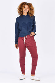 Model Summer wearing size 10 of the Weekend Picnic Pant in colour Burgandy (Purple), from the front, showing the whole outfit