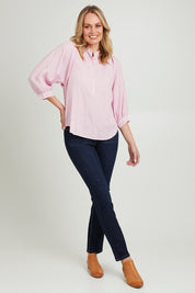 Model Grace wearing size 10 of the Rowan Shirt in colour Pwderpink (Pink), from the front, showing the whole outfit