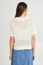 Model Madeline wearing size S of the Bay Knit in colour Pearl, from the back
