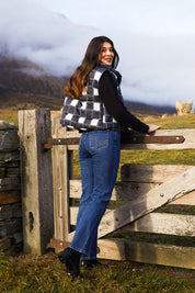 A model wearing the Cedar Check Puffer Vest in colour Navycheck (Blue), from the front, showing the whole outfit