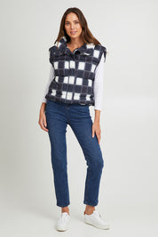 Model Madeline wearing size S of the Cedar Check Puffer Vest in colour Navycheck (Blue), from the front, showing the whole outfit