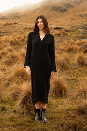 A model wearing the Maple Knit Dress in colour Black (Black), from the front, showing the whole outfit