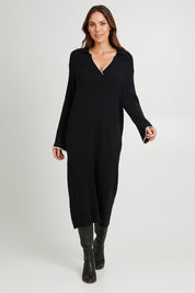 Model Madeline wearing size S of the Maple Knit Dress in colour Black (Black), from the front, showing the whole outfit
