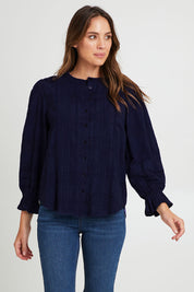 Model Madeline wearing size 10 of the Fennel Shirt in colour Navy (Blue), from the front, cropped image