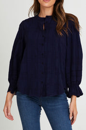 Model Madeline wearing size 10 of the Fennel Shirt in colour Navy (Blue), from the front, cropped image