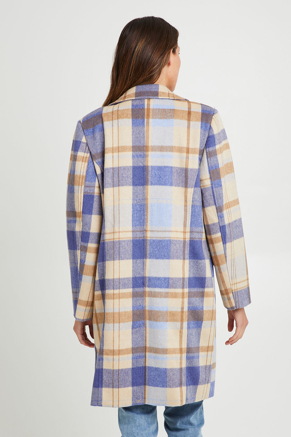 Model Madeline wearing size S of the Cove Check Coat in colour Navyhydra (Blue), from the back