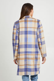 Model Madeline wearing size S of the Cove Check Coat in colour Navyhydra (Blue), from the back