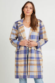 Model Madeline wearing size S of the Cove Check Coat in colour Navyhydra (Blue), from the front, cropped image