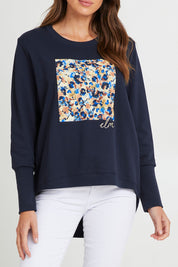 Model Madeline wearing size 10 of the Panorama Crew in colour Drksapp (Blue), from the front, cropped image