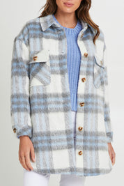 Model Madeline wearing size S of the Victory Check Shacket in colour Check (White), from the front, cropped image