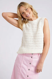 A model wearing the Janey Knit Vest in colour Pearl (White), from the front, cropped image