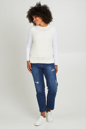 Model Olivia wearing size S of the Janey Knit Vest in colour Pearl (White), from the front, showing the whole outfit