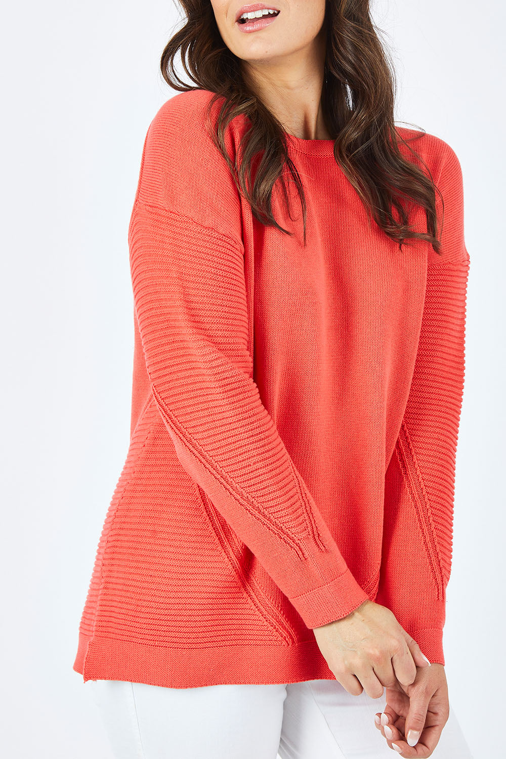 Model Shadae wearing size 10 of the Ember Knit in colour EmberGlow, from the front, cropped image