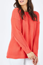 Model Shadae wearing size 10 of the Ember Knit in colour EmberGlow, from the front, cropped image