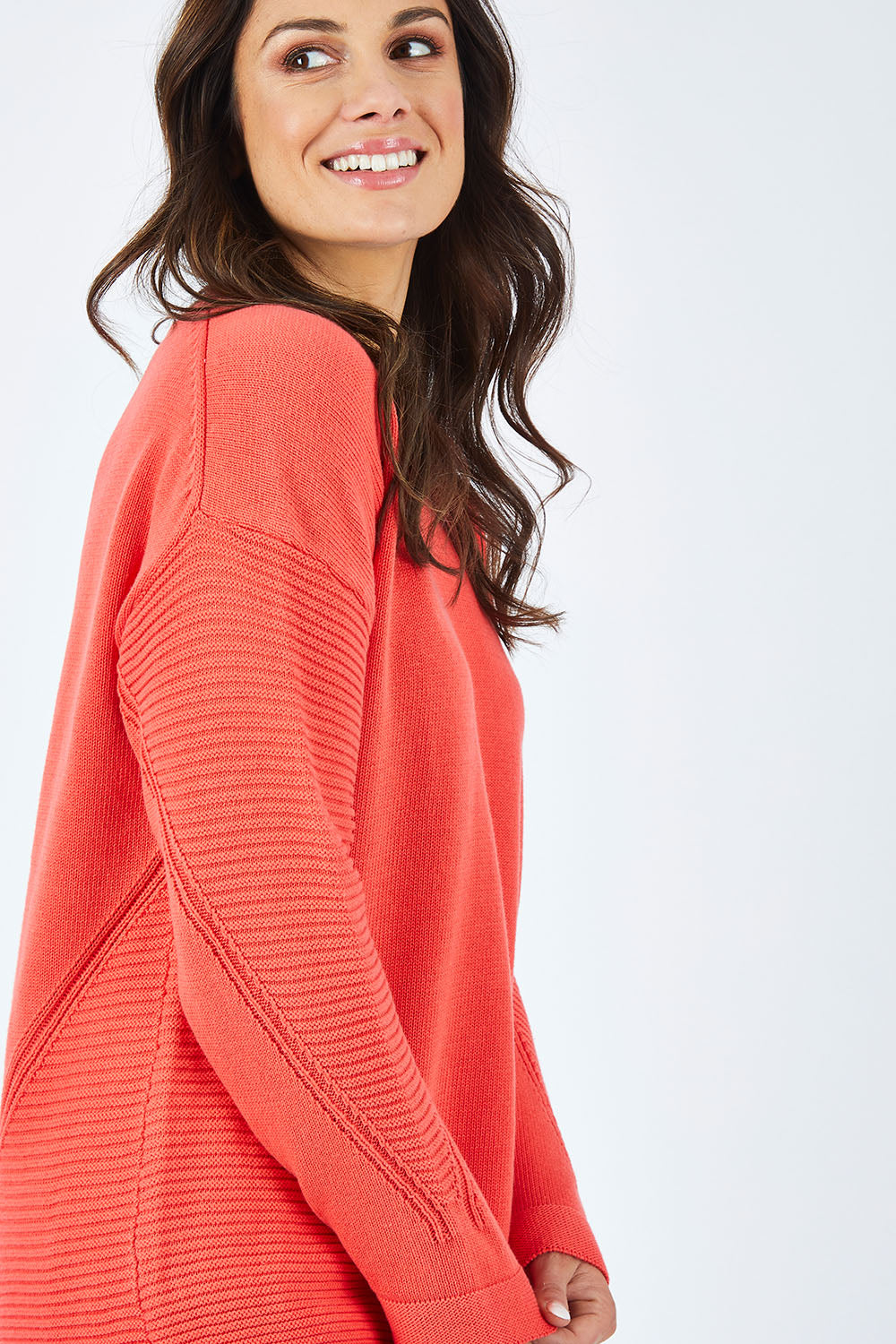 Model Shadae wearing size 10 of the Ember Knit in colour EmberGlow, from the front, cropped image