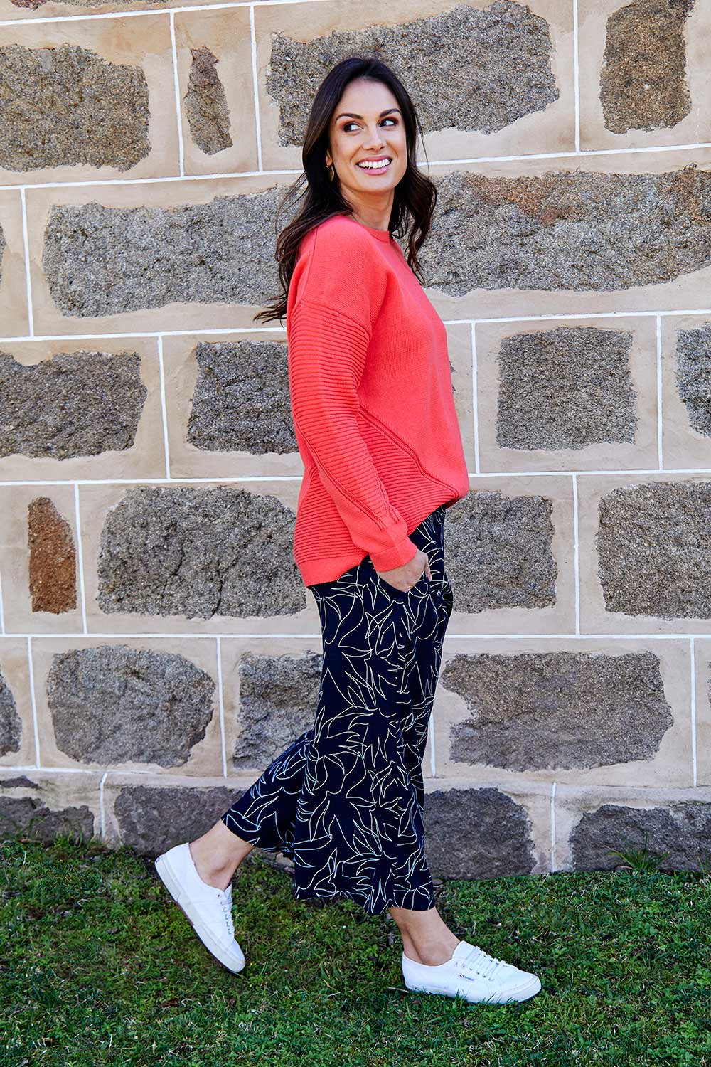 Model Shadae wearing size 10 of the Ember Knit in colour EmberGlow, from the front, showing the whole outfit