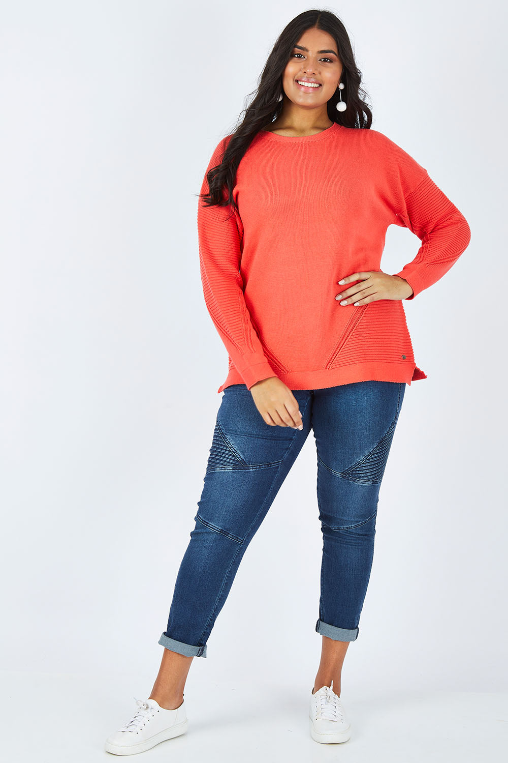 Model Shanaya wearing size 14 of the Ember Knit in colour EmberGlow, from the front, showing the whole outfit