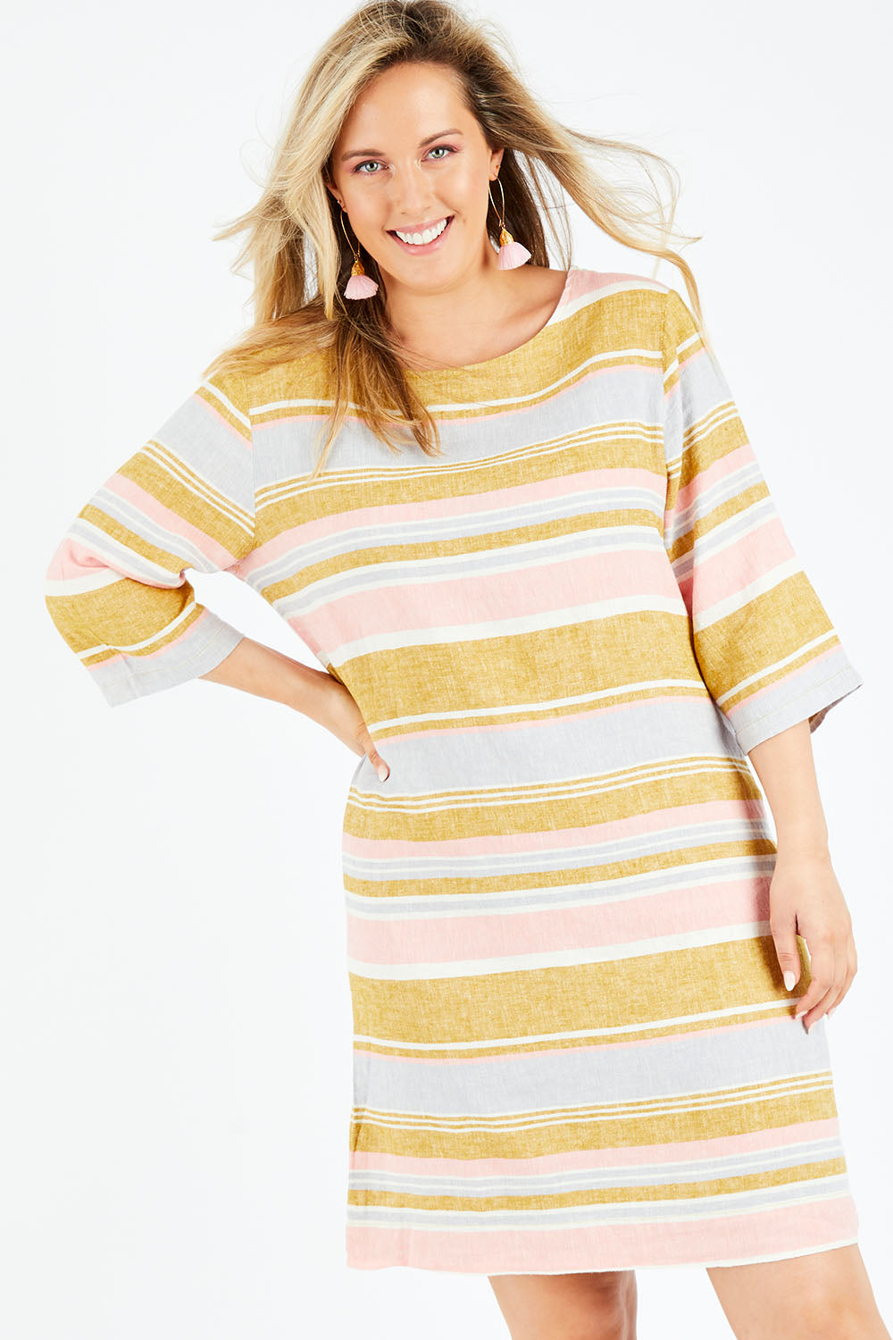 Model Jess wearing size 14 of the Juniper Stripe Dress in colour Multistrip (Pink), from the front, cropped image