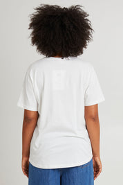 Model Olivia wearing size 10 of the Art House Cotton Tee in colour Marshmello (White), from the back