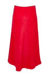 Product shot of the Eleni Linen Skirt in colour Bitterswee (Red), from the back
