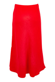 Product shot of the Eleni Linen Skirt in colour Poppy (Red), from the back