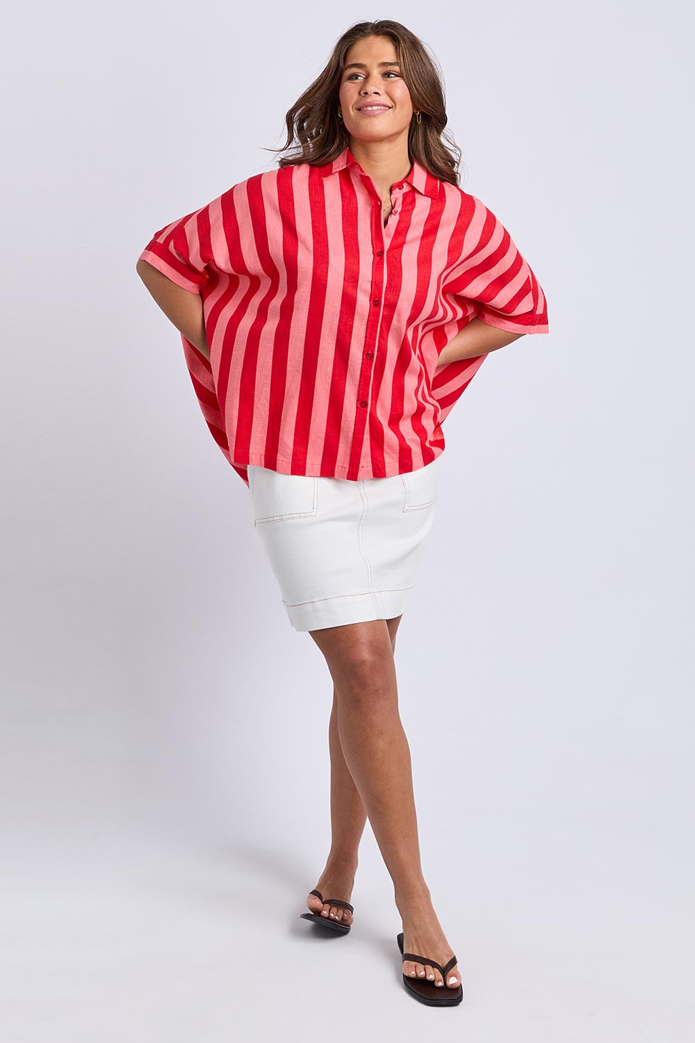 A model wearing the Palermo Linen Blend Stripe Shirt in colour Poppy, from the front, showing the whole outfit