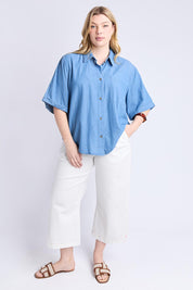 A model wearing the Blissful Chambray Ss Shirt in colour Midblue (Blue), from the front, showing the whole outfit