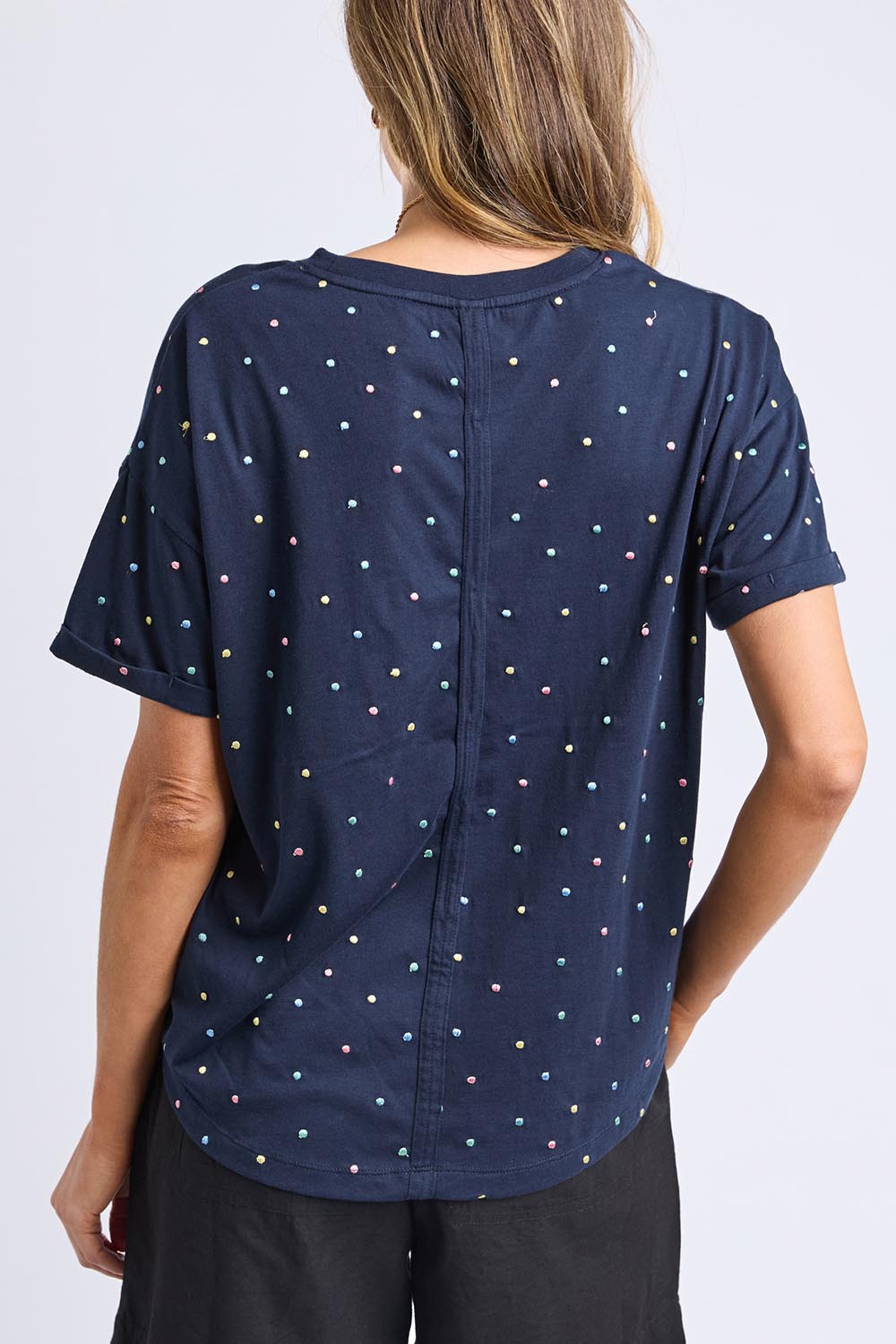 A model wearing the Festive Spot Cotton Blend Tee in colour Navy (Blue), from the front, cropped image
