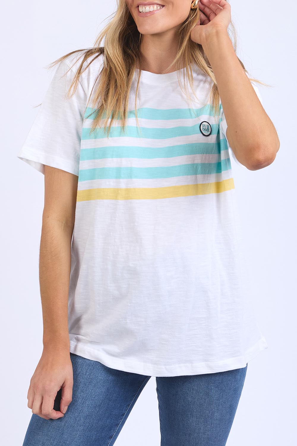A model wearing the Line Up Tee in colour Marshmello (White), from the front, cropped image