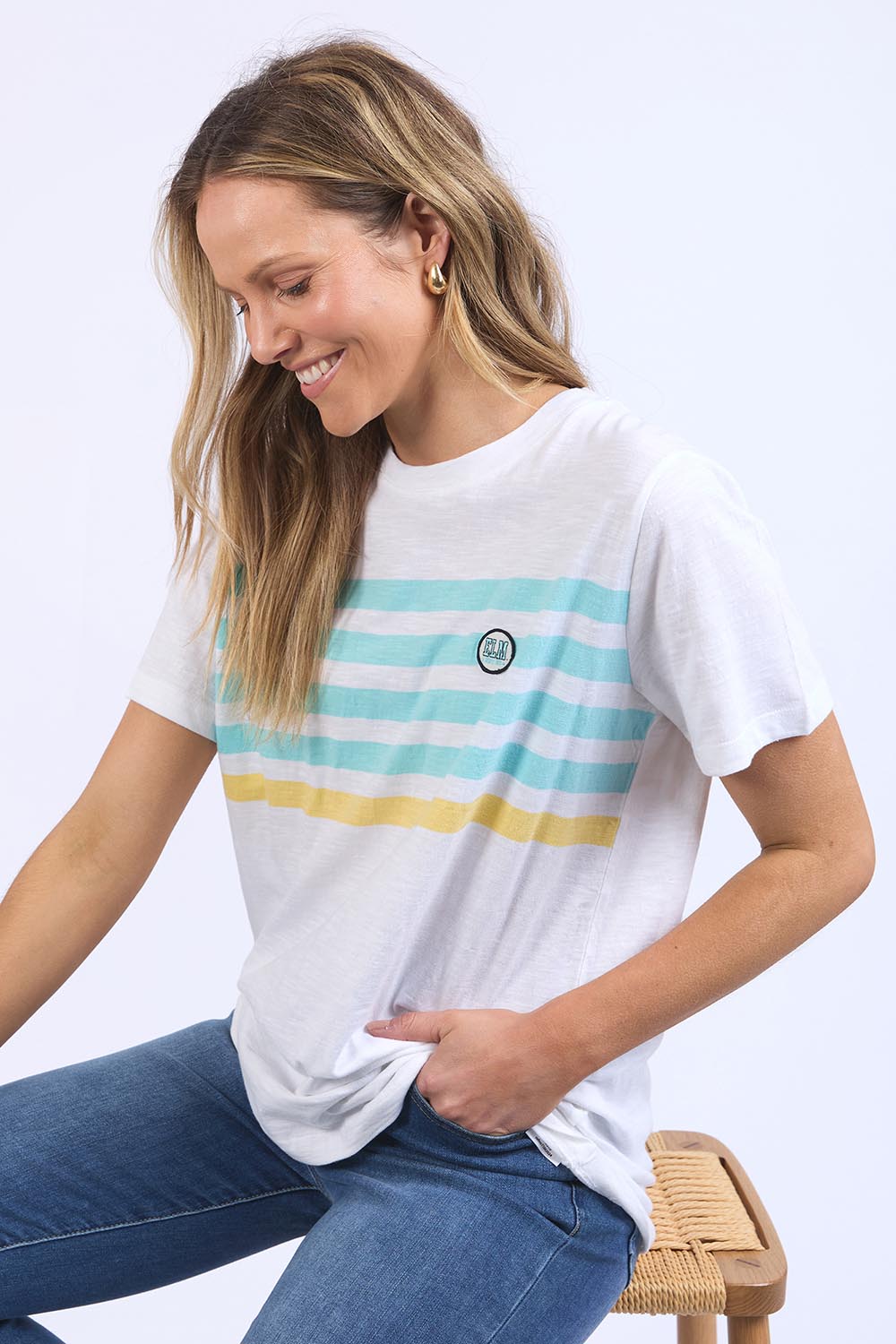 A model wearing the Line Up Tee in colour Marshmello (White), from the front, cropped image