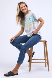 A model wearing the Line Up Tee in colour Marshmello (White), from the front, showing the whole outfit