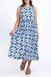 A model wearing the Painted Tile Linen Blend Dress in colour Geoprint (Blue), from the front, cropped image