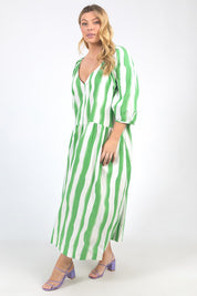 A model wearing the Spritz Stripe Linen Blend Dress in colour Greenwhite (Green), from the front, showing the whole outfit