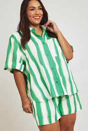 Model Ashleigh wearing size 16 of the Spritz Stripe Linen Blend Shirt in colour Greenwhite (Green), from the front, cropped image