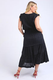A model wearing the Isabella Cotton Blend Dress in colour Black (Black), from the back